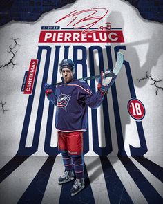 the hockey player is holding his glove up in front of a sign that says pierre - luc