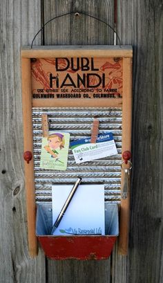 an old fashioned mailbox is attached to a wooden fence with magnets on it