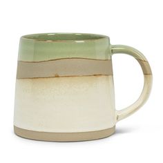 a white and green coffee mug with two brown bands on the outside, sitting in front of a white background