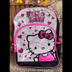 a hello kitty backpack with hearts on it