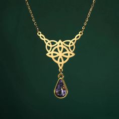 ⚜️Looking for a stunning piece of jewelry that exudes both style and spirituality? Look no further than our Celtics Knot Necklace! Crafted with Stainless Steel and adorned with a mesmerizing Crystal Rhinestone, this necklace will add a touch of magic to any outfit. Complete with an elegant pendant size of 32.5*27.9mm, it's the perfect accessory for any witch or crystal lover. Add it to your collection today and let its powerful energy guide you on your journey! ✨🔮 Mystical Clavicle Chain Jewelry As Gift, Mystical Clavicle Chain Jewelry For Gift, Mystical Teardrop Jewelry For Jewelry Making, Bohemian Teardrop Necklace For Weddings, Mystical Brass Jewelry, Mystical Teardrop Gemstone Jewelry, Gemstone Teardrop Pendant Necklace For Meditation, Mystical Sterling Silver Gold Necklace, Gold Mystical Sterling Silver Necklace