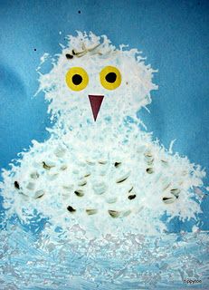 an owl made out of toilet paper on a blue background