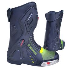 a pair of black motorcycle boots with yellow and green accents on the soles, side view