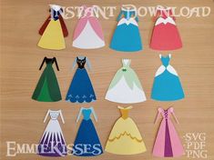 paper princess dresses are arranged on a table