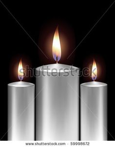 three white candles with one burning and the other on top of it, against a black background