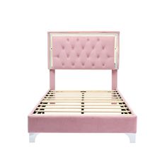 a pink bed frame with buttons on the headboard and foot board, against a white background