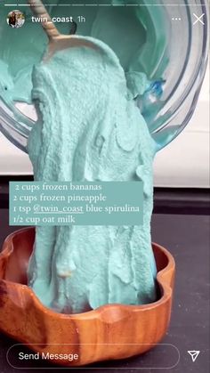 an ice cream sculpture in a wooden bowl on top of a black surface with the caption texting