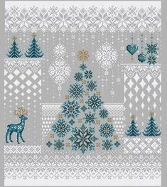 a cross stitch christmas tree with snowflakes and deers on it, surrounded by other holiday decorations