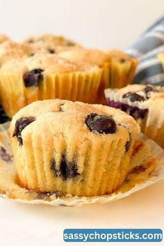 A mouth-watering blueberry muffin bursts with juicy blueberries, perfect for breakfast or a mid-day snack.