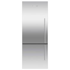 a silver refrigerator freezer sitting on top of a white counter