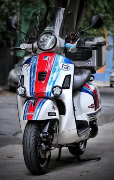 a motor scooter is parked on the street