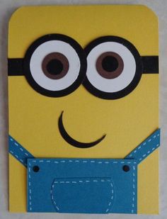 a yellow and blue minion with eyes sticking out of it's pocket