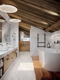 a large white bath tub sitting inside of a bathroom next to a wooden counter top