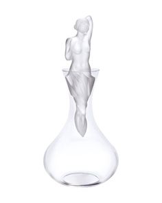 a glass vase with a figure in it