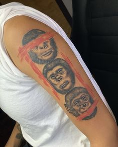 a man with three faces on his arm