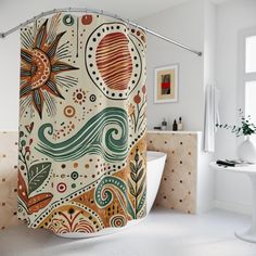 an artistic shower curtain in a bathroom