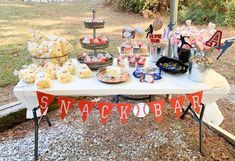 a table topped with lots of snacks and desserts