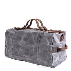 Weekend Ready: Retro Waterproof Canvas Duffel Bag This men's weekend duffle bag seamlessly blends timeless retro style with modern functionality, making it the perfect travel companion. Here's why you'll love it: Retro Chic: Classic canvas and metal hardware add timeless character to your travels. Built to Last: Durable, water-resistant construction ensures your gear stays dry and protected. Pack & Go Ease: Spacious interior and comfy handles make packing and carrying a breeze. Black Waxed Canvas Duffle Bag For Travel, Black Waxed Canvas Travel Duffle Bag, Gray Travel Bag With Luggage Sleeve, Large Capacity Waxed Canvas Duffle Bag, Large Capacity Rectangular Waxed Canvas Duffle Bag, Rectangular Waxed Duffle Bag For Overnight Trips, Functional Waxed Finish Duffle Bag For Travel, Gray Rectangular Duffle Bag For Travel, Gray Travel Bag With Luggage Sleeve For Daily Use