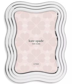 the kate spade new york frame is shown in pink and white with an ornate design