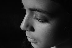 a black and white photo of a woman's face