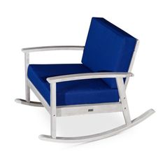 a white rocking chair with blue cushions on the seat and back, against a white background