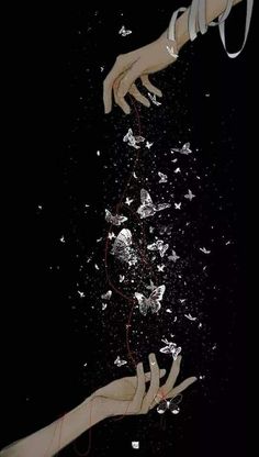 two hands reaching for each other in the air with shattered glass all around them on a black background