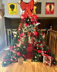 a christmas tree decorated with red and gold ornaments