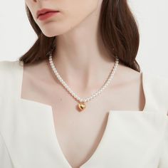 Round of pearl and heart charm necklace. This necklace is perfect for any occasion, even when you don't have one! ………………………………….D E T A I L S• Materials: Stainless steel, 18k gold plating.• Length: 14 inches (35 cm) + extension 2 inches (5 cm)• This product is hypoallergenic, water and tarnish resistant White Pearl Chain Heart Necklace, Heart Pendant Pearl Necklace For Valentine's Day, Dainty Pearl Heart Necklace, Anniversary Pearl Charm Heart Necklace, Heart Shaped Pearl Necklace, Contemporary Fine Jewelry, Heart Charm Necklace, One D, Minimal Jewelry