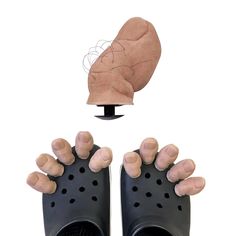 a pair of black rubber shoes with hands and feet