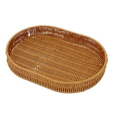 an oval wicker tray with handles on a white background for use as a serving tray