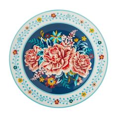 a blue and white plate with pink flowers on the rim, against a white background