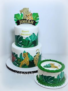 two tiered cake decorated with the lion king and jungle princess characters on it's sides