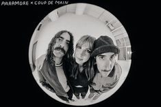 three people are taking a selfie in a fisheye lens with the caption paramore x - coup main