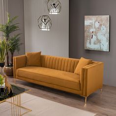 a living room scene with focus on the couch and coffee table in the foreground