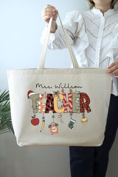 Christmas Teacher Tote Bag, Personalized Christmas Teacher Bag, Christmas Gift for Teacher, Custom Christmas Teacher Gifts, Teacher Tote Bag HOW TO ORDER: 1. Please, Check and Review all Photos.  2. Select Your Bag Style and Color from the drop-down menu 3. Choose Your Quantity as much as you want. 4. Click "Add To Cart". For multiple items go back to the listing and repeat the steps. *DETAILS OF THE BAGS: 25L Tote Bag Measurements - 20"L x 15"H x 5"D 100% cotton , 25" self-fabric handles , 11" handle drop Large main compartment with zippered closure Inside zippered flap pouch pocket * PROCESSING & SHIPPING: Processing time is 1-2 days. First Class Shipping is 2-5 business days (after processing time). You can upgrade your shipping on the check out page to UPS Ground and UPS-2 Day Business Unique Teacher Gifts Handbags, Red Canvas-lined Tote Bag, Teacher Canvas Bag, Red Monogram Canvas Bag With Gold-tone Hardware, White Tote Bag For Teacher Appreciation, Custom Teacher Gifts, Christmas Tote Bags, Christmas Tote, Teacher Bags