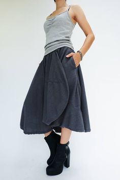 "🚚..ALL ORDERS ARE SHIPPED VIA DHL EXPRESS MAIL Treating every design as a piece of art, look no further than asymmetric midi skirt/pants. This special design skirt has one leg of pants. Asymmetric panelled construction. Wide elastic waistband. Tonal stitching. Asymmetric hem. * Pull-on style * 2\" elastic waistband * The skirt has one left leg of pants * Tonal stitching * Side seam pockets * Asymmetric hem * Unlined Measurements approximately: Waist: 26\" stretching to 46\" (66 cm-117 cm)-elas Avant Garde Skirt, Design Skirt, Black Romper, Special Design, Black Charcoal, Dhl Express, Asymmetric Hem, Skirt Pants, Blue Gray