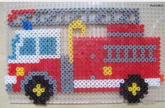 this is an image of a lego firetruck made out of plastic beads on a white background