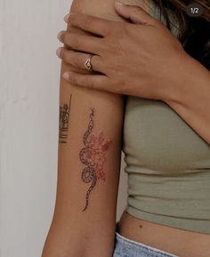 a woman with a tattoo on her arm