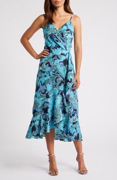 This sleeveless midi, fashioned with a wrapped bodice and a ruffled high/low skirt, is sure to be a warm-weather favorite. 33" to 41 1/2" center front length (size Medium) Hidden back-zip closure Surplice V-neck Adjustable straps Lined 99% polyester, 1% spandex Machine wash, line dry Imported Blue V-neck Wrap Dress With Ruffles, Blue Wrap Dress With Surplice Neckline For Summer, Blue Floral Print Maxi Dress With Asymmetrical Hem, Blue Midi Dress With Asymmetrical Floral Print Hem, Blue Wrap Dress With Surplice Neckline For Beach, Blue Surplice Neckline Wrap Dress For Beach, Green Sleeveless Wrap Dress, Blue High-low Hem Midi Dress For Spring, Blue Midi Dress With High-low Hem For Spring