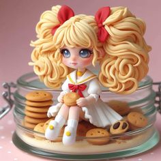 a close up of a figurine in a glass bowl with cookies on the side