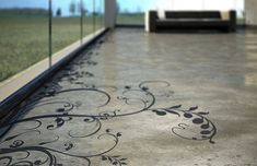 the floor is decorated with black and white designs on it's sides, along with glass walls