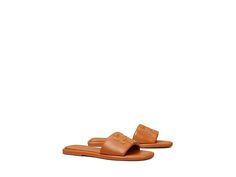 Tory Burch Double T Sport Slide - Women's Shoes : Aged Camello/Gold : Slip right into style and comfort with Tory Burch Double T Sport Slides! Upper, lining, and insole made of leather material. Slip-on construction. Iconic Tory Burch double T logo on vamp. Open snip-toe silhouette. Man-made outsole. Imported. Measurements: Weight: 7 oz Product measurements were taken using size 9, width M. Please note that measurements may vary by size. Weight of footwear is based on a single item, not a pair. Classic Tan Sandals With Leather Lining, Classic Tan Sandals With Leather Sole, Classic Tan Slip-on Sandals, Classic Tan Leather Sandals, Tan Leather Casual Sandals, Casual Tan Sandals With Leather Sole, Casual Tan Sandals With Leather Lining, T Logo, Slides Women