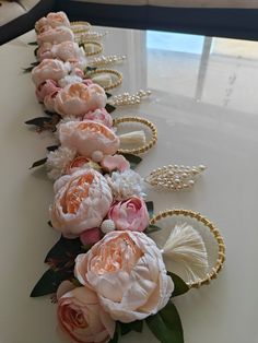 the flowers are lined up on the table to be decorated with pearls and beading