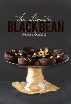 the ultimate black bean biscuits on a glass cake plate with text overlay that reads, the ultimate black bean cookies