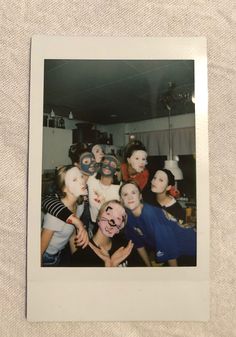 a group of people with masks on their faces