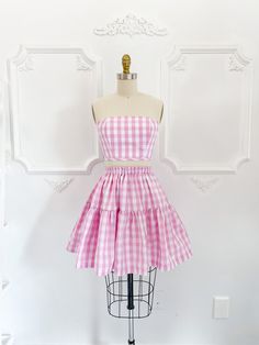 "The Petticoat Lane set is what summer outfit dreams are made of! Super limited edition pink gingham print inspired by everyone's favourite doll.  Skirt measures 18-20\" long from top of waistband depending on size. ♡ The Jordan de Ruiter collection is hand crafted in Canada in-studio & by small run manufacturers. Made to order, please see the shipping section for current turnaround on this item. Please choose the size that is closest to your measurements. If you are unsure please send your exac Fitted Gingham Skirt For Summer, Gingham Skirt For Summer Picnic, Summer Gingham Skirt For Picnic, Summer Gingham Dress With Tiered Skirt, Fitted Cotton Skirt For Picnic, Pink Summer Dress With Gathered Skirt, Summer Pink Dress With Gathered Skirt, Spring Picnic Skirt With Ruffles, Plaid Fitted Skirt For Picnic