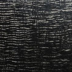 an abstract black and white painting with lines on the surface, as if it were painted in