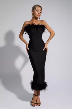 Elegant Black Ostrich Feather Dress, Chic Ostrich Feather Dress For Night Out, Elegant Strapless Dress With Feather Trim, Black Strapless Dress With Feathers, Chic One-shoulder Dress With Feather Trim, Elegant Club Dress With Feathers, Strapless Club Dress With Feathers, Strapless Club Dress With Feather Trim, Black Ostrich Feather Dress For Night Out