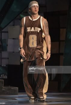 a man in a basketball uniform on stage