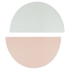 a white and pink circular mirror on a white background with one half in the same color